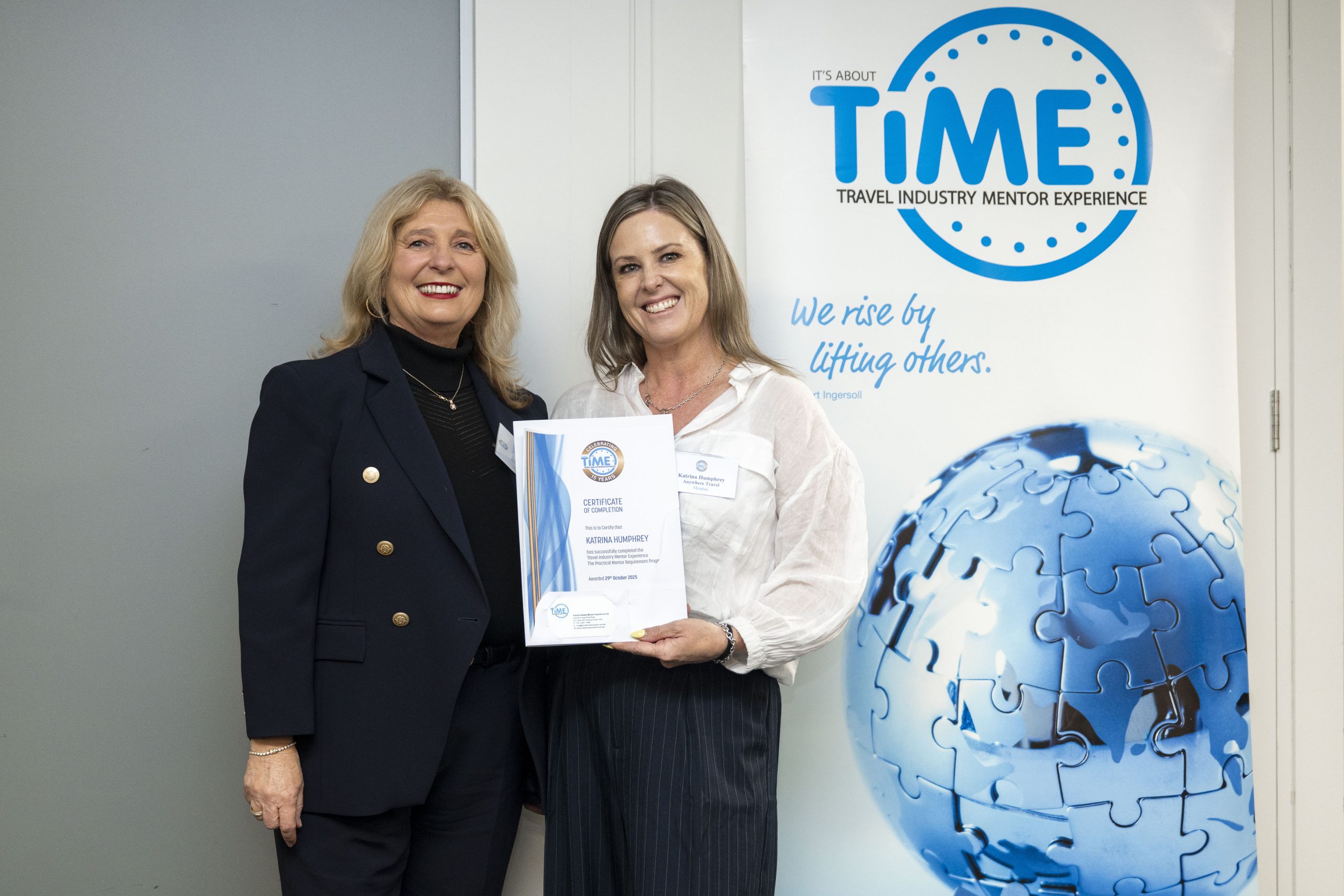Penny Spencer celebrating with a TIME graduate